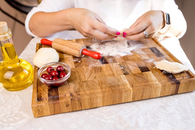 Hands preparing a rustic dish